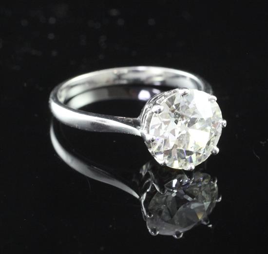 An 18ct white gold and solitaire diamond ring, size M.